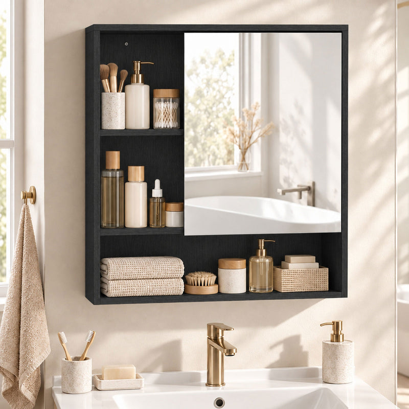 Black wall-mounted mirror cabinet styled with towels and toiletries above a vanity with gold taps