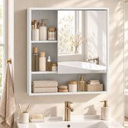 White mirror cabinet above a basin with toiletries and towels on the shelves