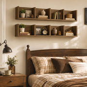 Two Homcom CD storage shelves mounted above a bed displaying books, plants and a clock