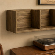 Close-up of the Homcom CD storage shelf's open cube compartments and walnut brown wood grain