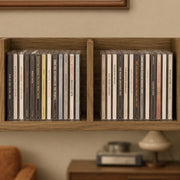 Close-up of CDs filling two cube compartments of the Homcom storage shelf