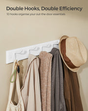 The rack using all 10 hanging points for a bag, scarf, knitwear, coats and a hat