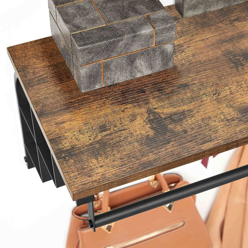 Storage boxes on the rustic brown shelf with a handbag hanging from the rail below