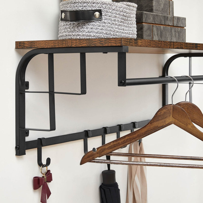 Close-up of the shelf edge, hanging rail and hooks holding a hanger and umbrella