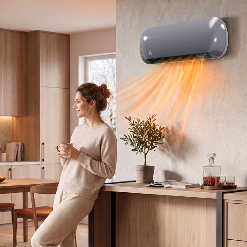 Grey wall heater running in an open plan kitchen and dining area while a woman holds a mug