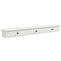 White wall mounted hallway shelf with 3 fluted drawers and black knobs on a white background