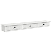White wall mounted hallway shelf with 3 fluted drawers and black knobs on a white background