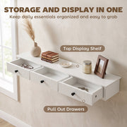 White shelf with all 3 drawers pulled open showing glasses and keys stored inside