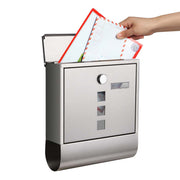 Hand posting a letter into the top slot of the SONGMICS wall-mounted mailbox