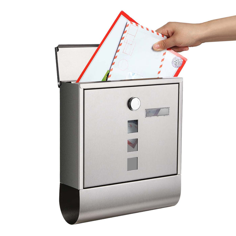 Hand posting a letter into the top slot of the SONGMICS wall-mounted mailbox
