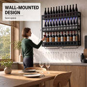Woman reaching for a wine glass from the wall-mounted rack in a kitchen dining area