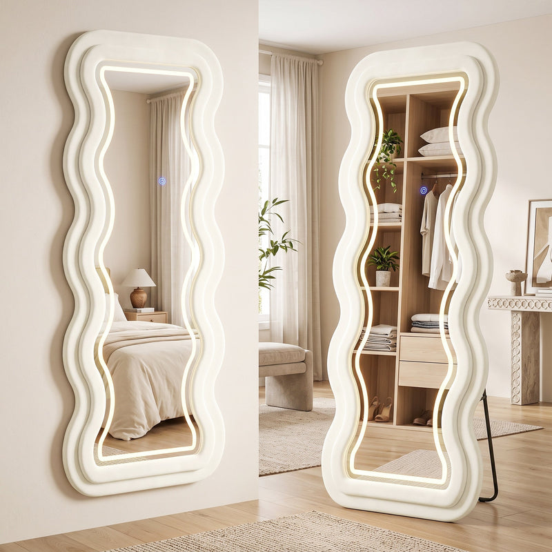 Wavy mirror shown wall-mounted in a bedroom and freestanding beside an open wardrobe