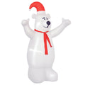 Inflatable white Christmas bear in a Santa hat and red scarf on a white background