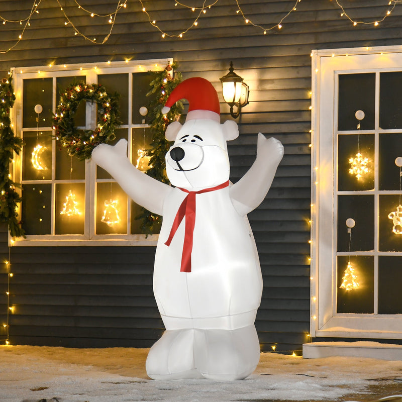 Inflatable bear in front of a house with a wreath and window Christmas lights