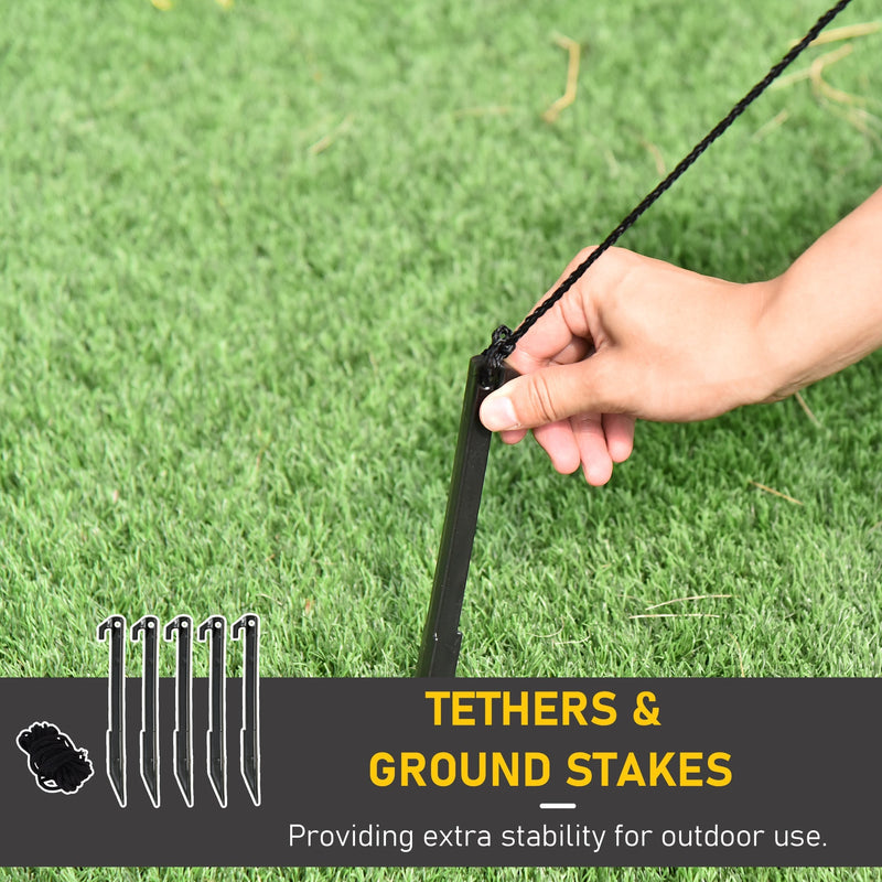Hand tying a tether rope to a ground stake with tethers and ground stakes label