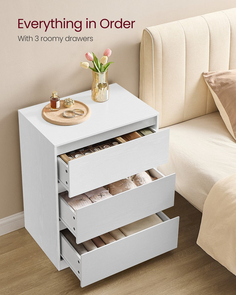 White chest of drawers with all 3 drawers open showing folded clothes inside
