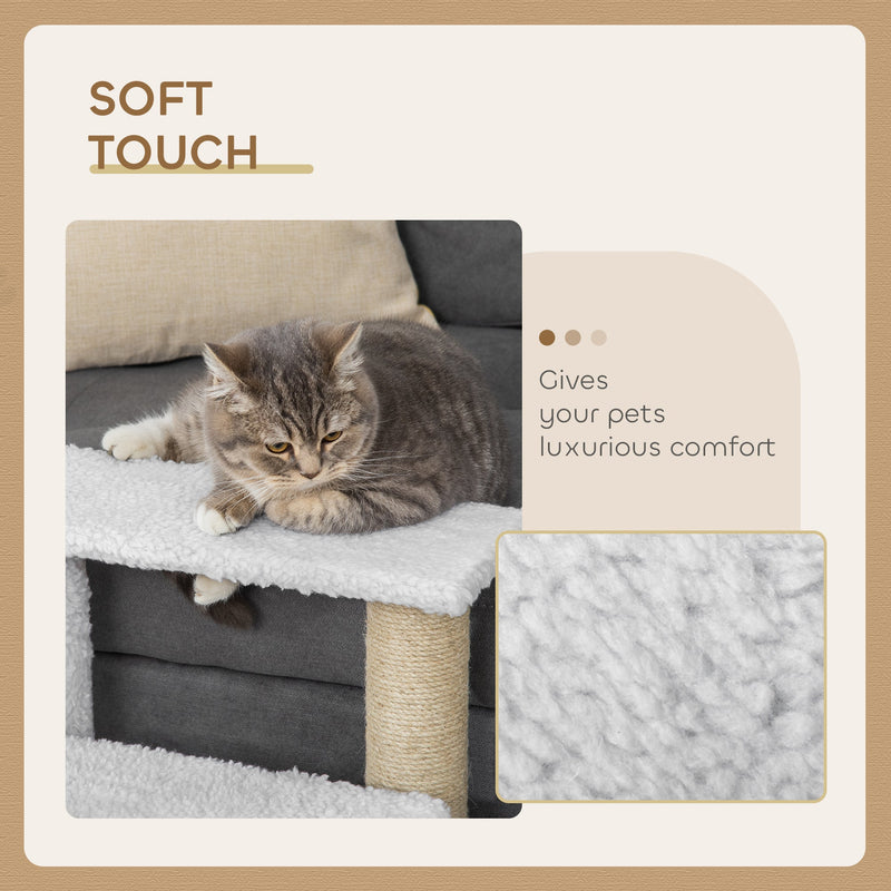 Cat resting on a plush step with a close-up of the soft white plush fabric