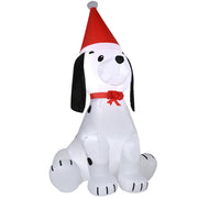 Inflatable puppy dog in a Santa hat from a slight angle on a white background