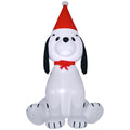 White inflatable puppy dog with black ears, a red Santa hat and a red bow on a white background