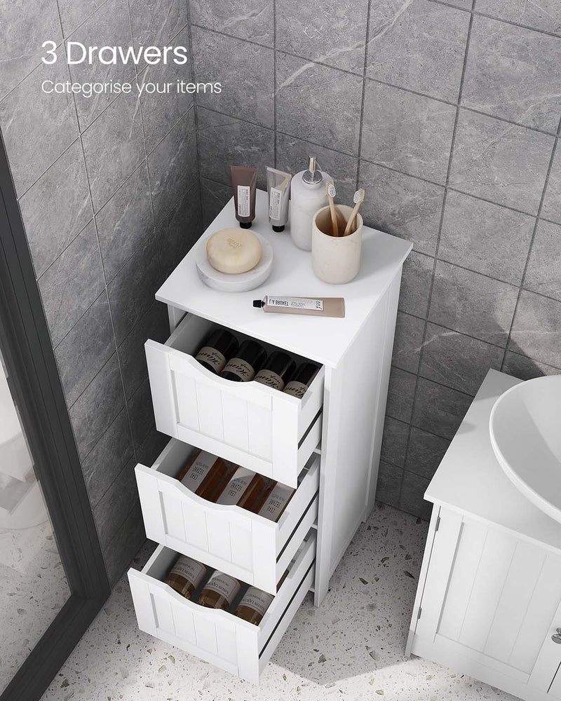 All 3 drawers pulled open holding bottles, cabinet beside a shower screen