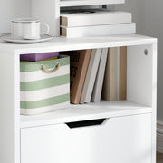 Close-up of the open compartment holding books and a striped storage basket