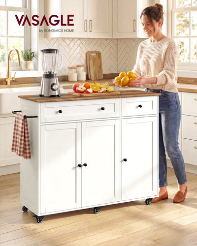 Woman preparing fruit at the white kitchen island trolley with a brown worktop
