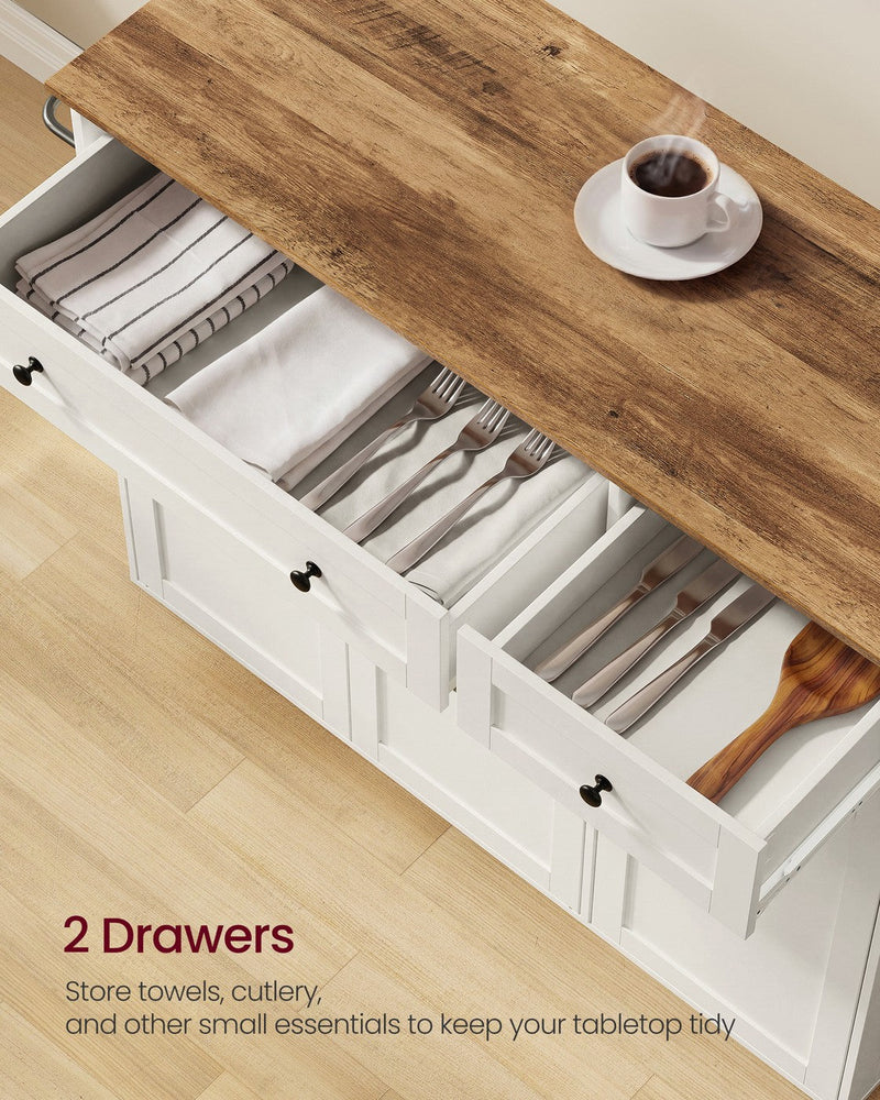 Open drawer holding cutlery and tea towels, with a mug on the brown worktop above