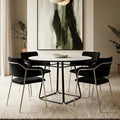 White ceramic marble effect round dining table seating 4 in a bright kitchen