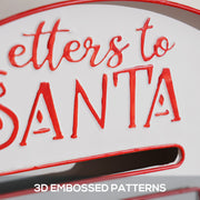 Close-up of raised red Letters to Santa lettering above the letter slot