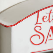 Close-up of the curved white roof edge with red trim and embossed lettering
