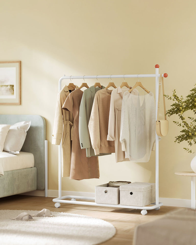 White clothes rail on wheels, close-up of steel frame and castor wheel
