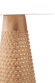 Close-up of the hammered gold finish and embossed dot detailing on the base