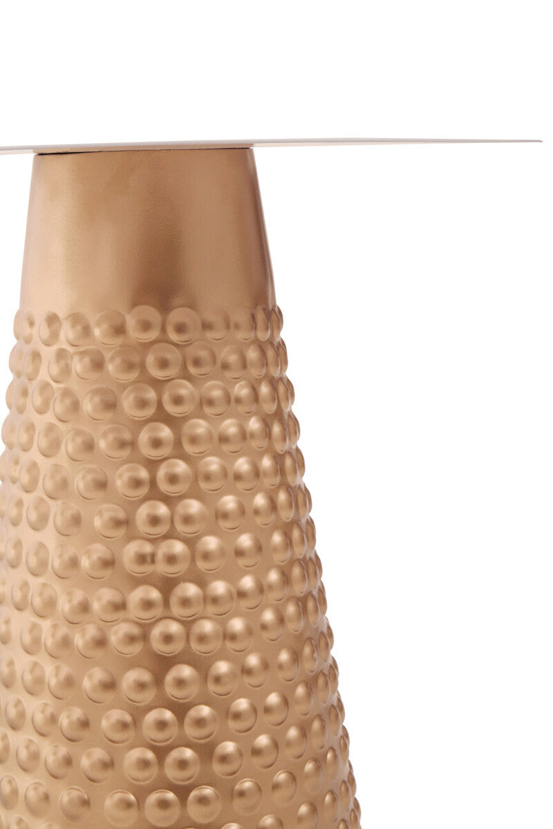 Close-up of the hammered gold finish and embossed dot detailing on the base