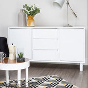 White high gloss sideboard styled in a dining room setting