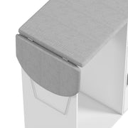 Close-up of the grey linen-look ironing top and folding section above the white cabinet