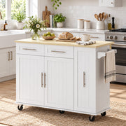 Closed white kitchen island with a towel on the side rack in a bright kitchen
