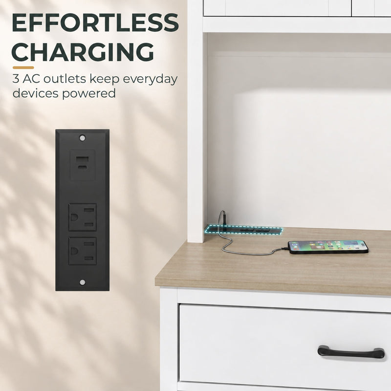 Close-up of the built-in power strip with AC outlets charging a phone