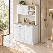 White pantry cabinet beside a glass shower screen, styled with bottles and books