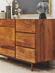 White marble top acacia wood sideboard in a lifestyle living room setting
