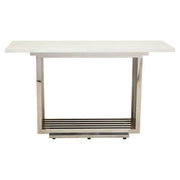 White marble effect console table with silver geometric base on a plain background