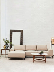 White marble coffee table shown in a warm, neutral lounge scheme