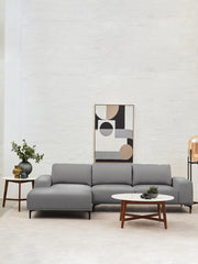 Round marble-topped coffee table in a Japandi-inspired living room