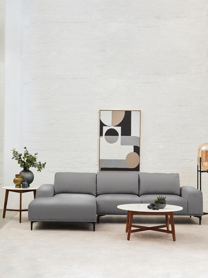 Round marble-topped coffee table in a Japandi-inspired living room