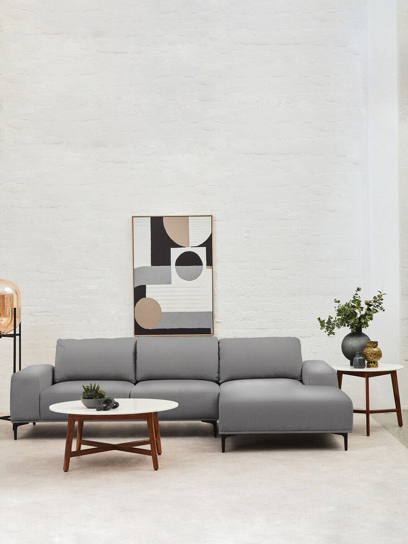 Marble and acacia coffee table in a family living room setting