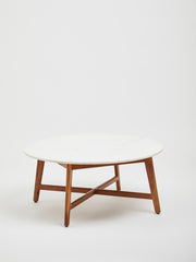 Marble and acacia coffee table in a neutral-toned living room setting