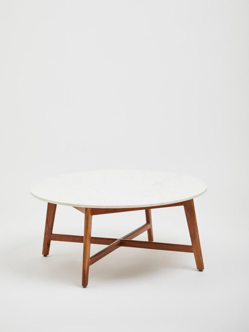 Marble and acacia coffee table in a neutral-toned living room setting