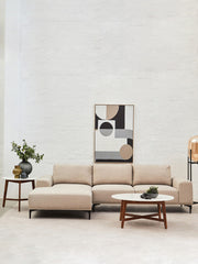 Marble top coffee table styled with a tray and ceramics in a living room