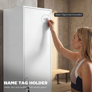 Hand placing a name tag in the name tag holder on the locker door