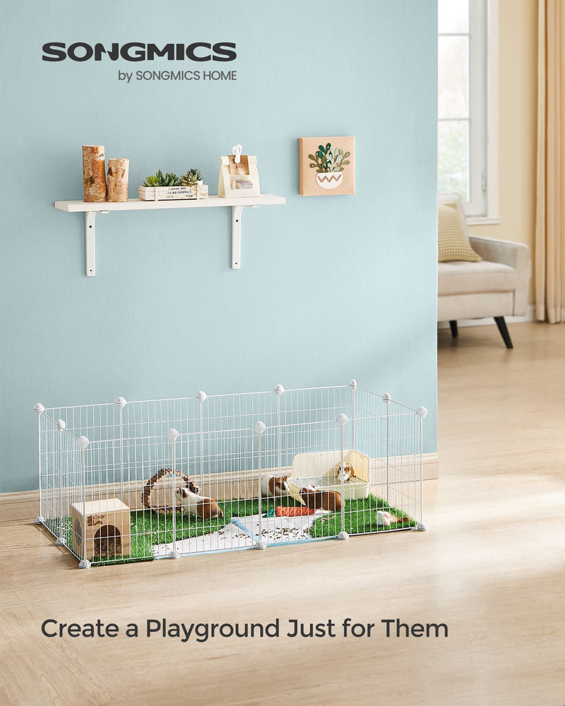 Songmics white wire playpen on a living room floor with grass mat, hide and guinea pigs