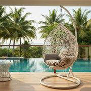 White rattan effect hanging chair styled in a living room setting